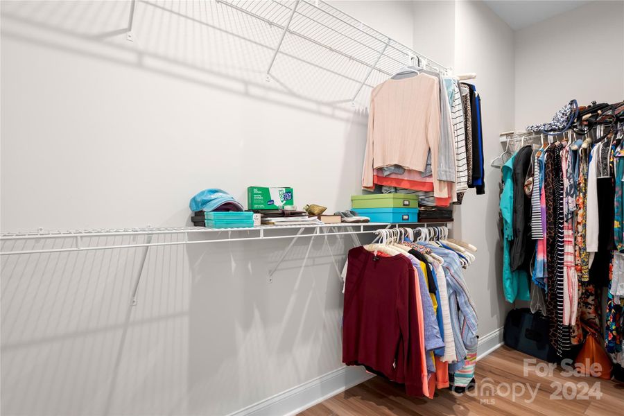 Huge wraparound walk-in closet right off of the Primary Ensuite Bath has endless possibilities for storage!