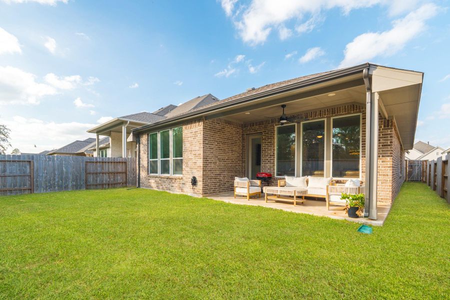 Exterior details and patio area of a home in Grand Central Park, Conroe (Image 27).