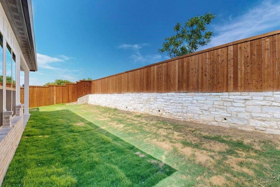 View of fenced backyard