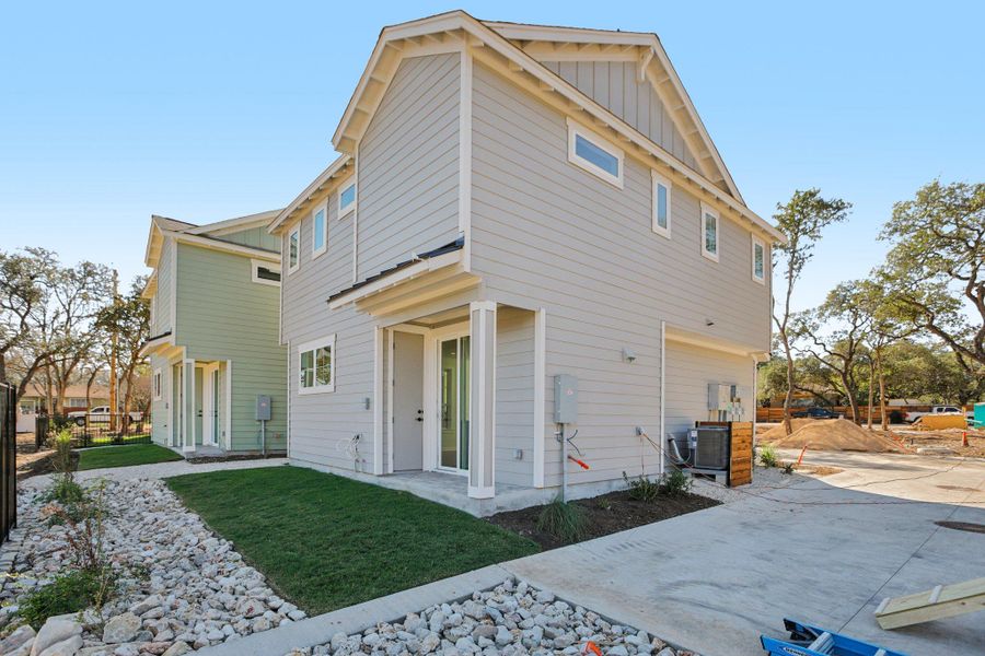 Rear view of house with board and batten siding
