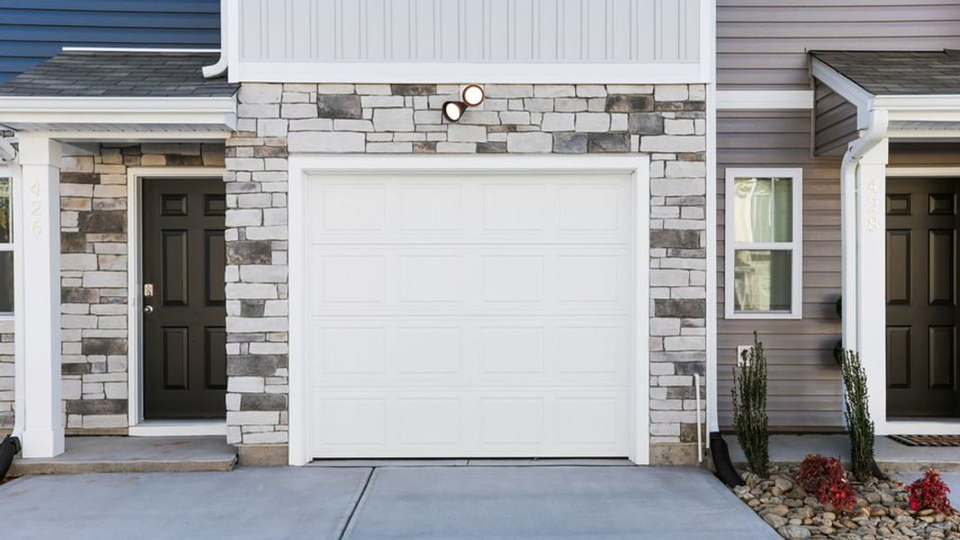 Exterior details and patio area of a home in Chestnut Ridge Townhomes, Greenville (Image 3). Exterior details and patio area of a home in Chestnut Ridge Townhomes, Greenville (Image 3).