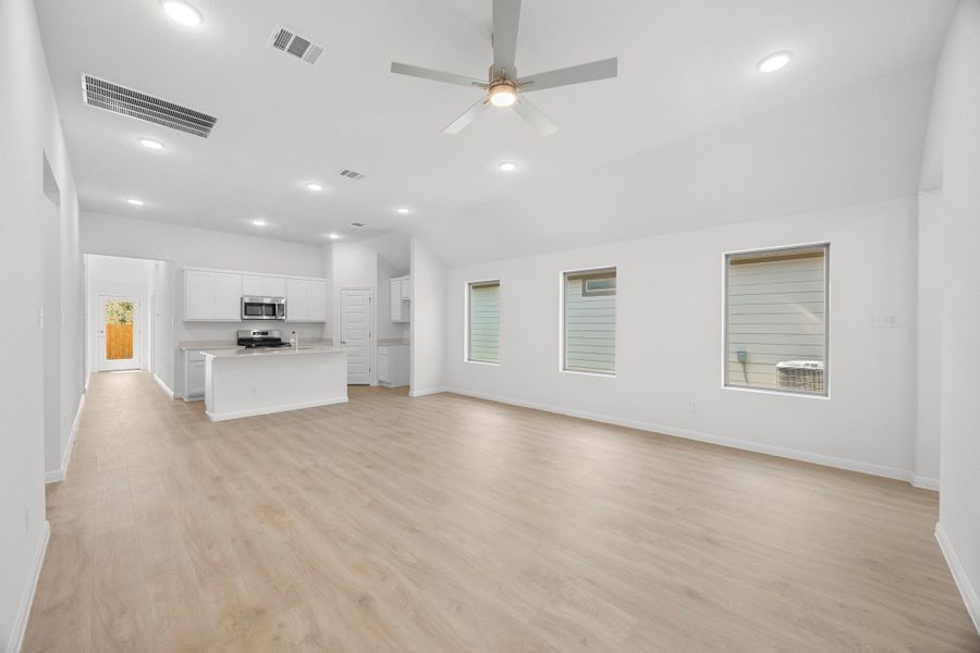 Living and Dining Area in the Cypress home plan by Trophy Signature Homes - REPRESENTATIVE PHOTO