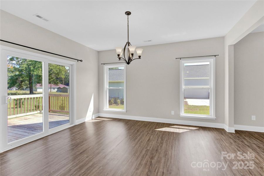 Breakfast area. Walk out to spacious deck overlooking huge backyard.