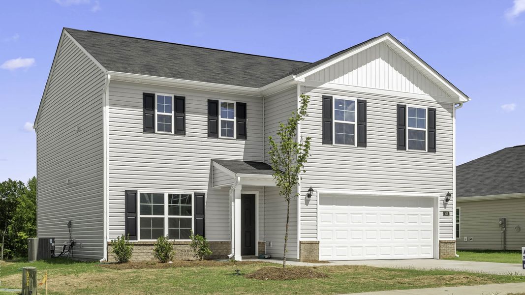 Front exterior of a new home in Cambridge Park, Mebane, NC, highlighting curb appeal (Image 2). Front exterior of a new home in Cambridge Park, Mebane, NC, highlighting curb appeal (Image 2).