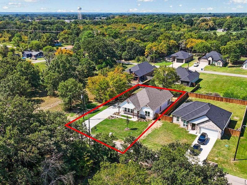Aerial view of residential area with property boundaries highlighted Aerial view of residential area with property boundaries highlighted