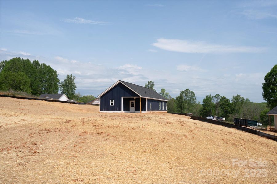 Front exterior of a new home in , Clover, SC, highlighting curb appeal (Image 24).
