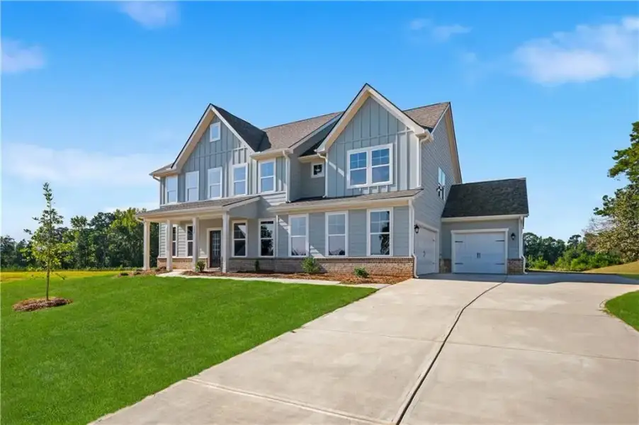 Front exterior of a new home in Brighton, Locust Grove, GA, highlighting curb appeal (Image 18).