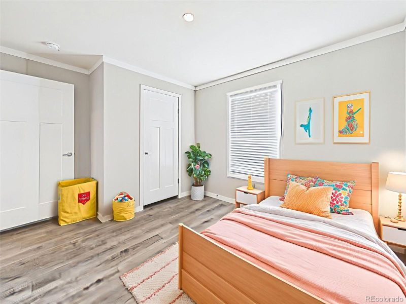 Virtually Staged Secondary Bedroom – Perfectly staged for a child’s room or guest retreat, this bedroom features soft gray walls and a double-door closet.