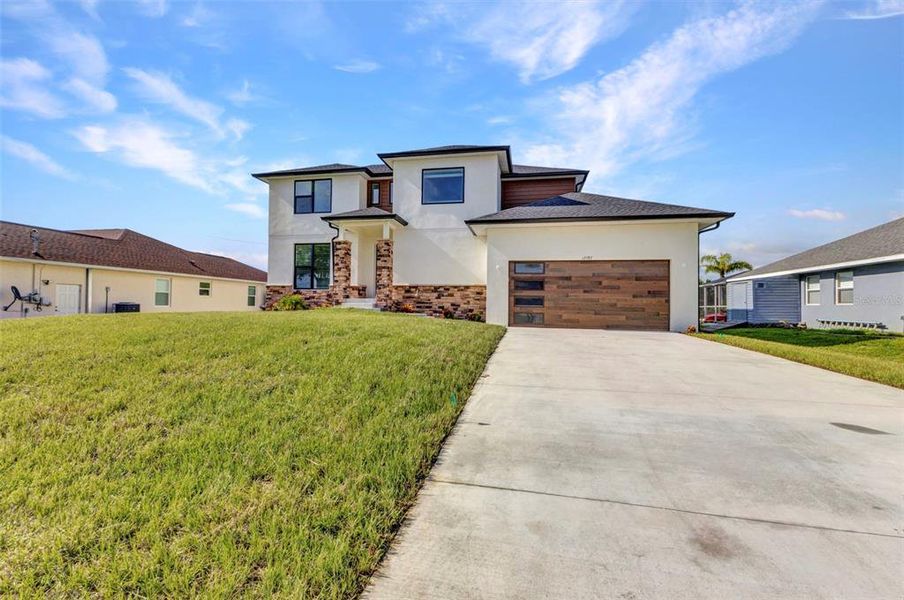 Front exterior of a new home in , Port Charlotte, FL, highlighting curb appeal (Image 29).