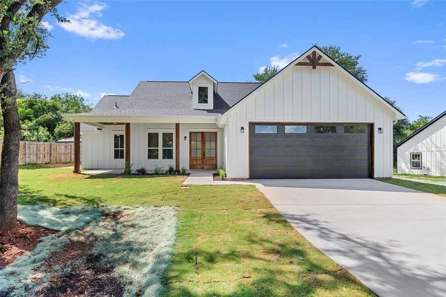 Front exterior of a new home in , Granbury, TX, highlighting curb appeal (Image 18).