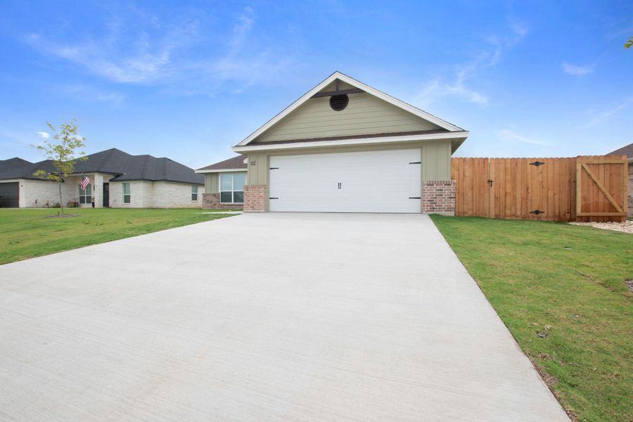 Front exterior of a new home in , Burnet, TX, highlighting curb appeal (Image 2). Front exterior of a new home in , Burnet, TX, highlighting curb appeal (Image 2).