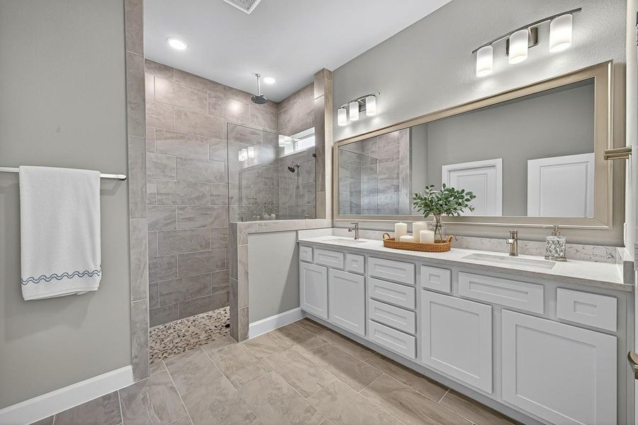 Modern and inviting bathroom featuring a spacious walk-in primary shower and elegant double vanity, virtually staged for a glimpse of your future oasis. Modern and inviting bathroom featuring a spacious walk-in primary shower and elegant double vanity, virtually staged for a glimpse of your future oasis.
