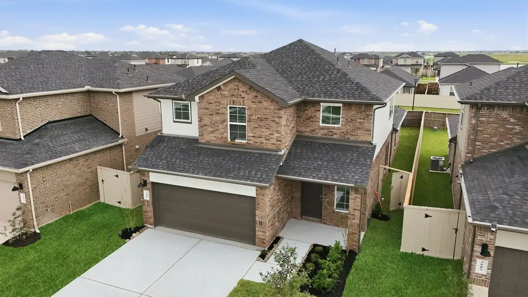 Front exterior of a new home in Lakes at Westland Ranch, League City, TX, highlighting curb appeal (Image 2).