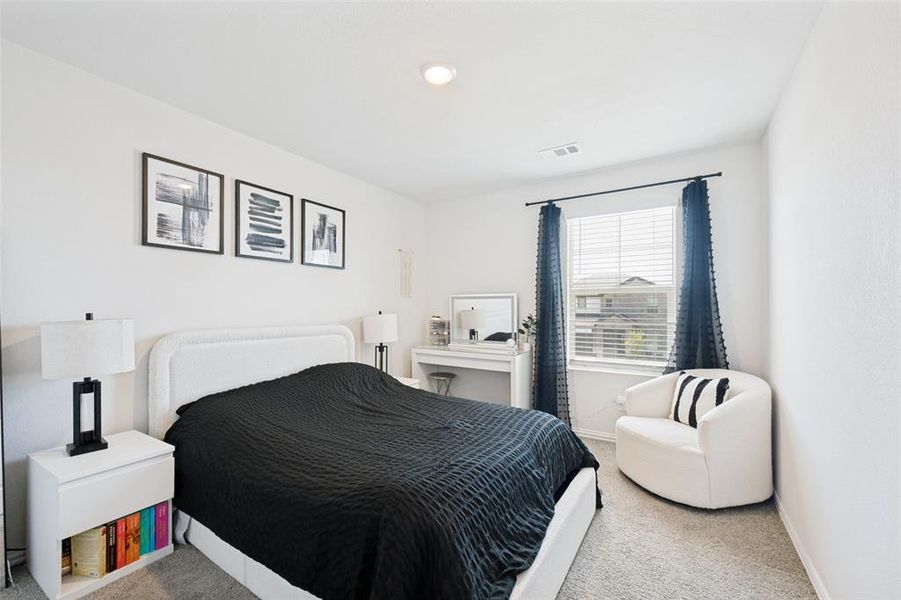 Carpeted bedroom featuring white walls, a recessed ceiling light, and a window with blinds and dark curtains Carpeted bedroom featuring white walls, a recessed ceiling light, and a window with blinds and dark curtains