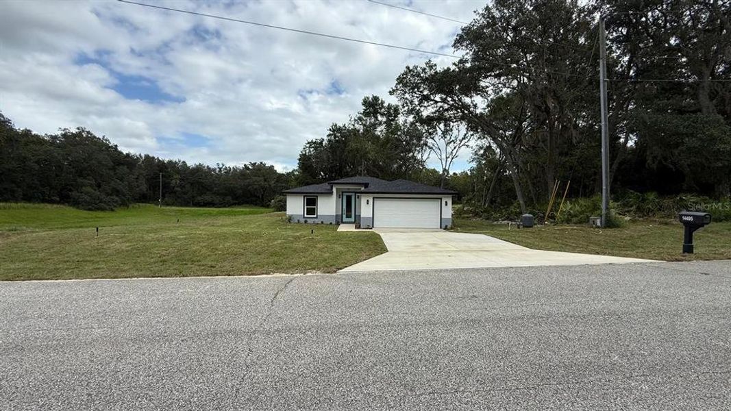 Front exterior of a new home in , Ocala, FL, highlighting curb appeal (Image 1). Front exterior of a new home in , Ocala, FL, highlighting curb appeal (Image 1).