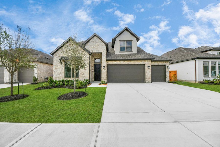 Front exterior of a new home in Marvida, Cypress, TX, highlighting curb appeal (Image 23).