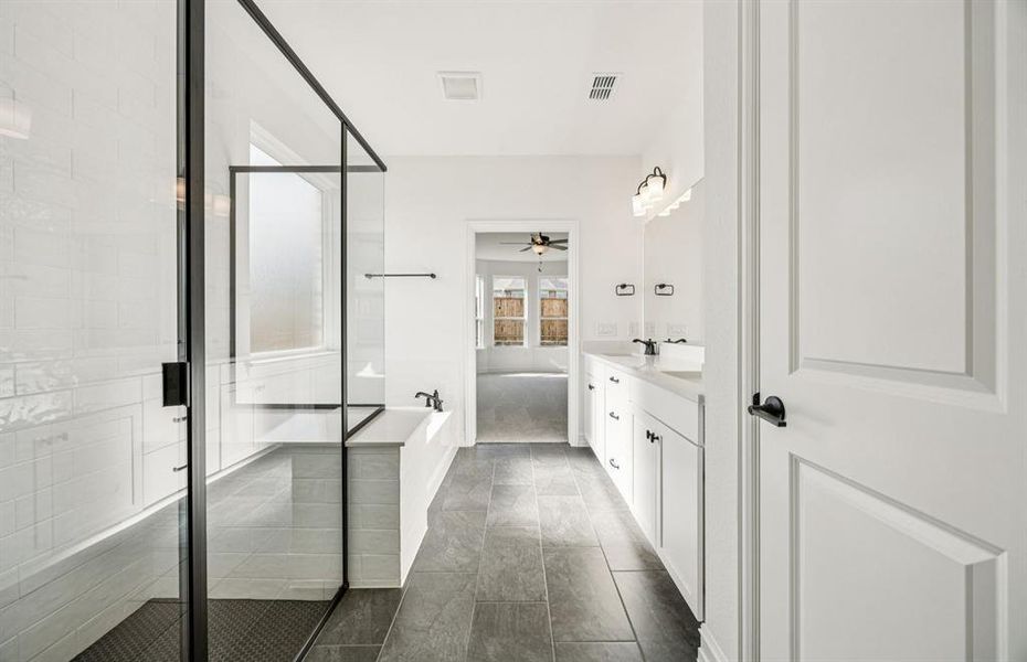 Luxurious owner's bath complete with double sinks and a generous shower Luxurious owner's bath complete with double sinks and a generous shower