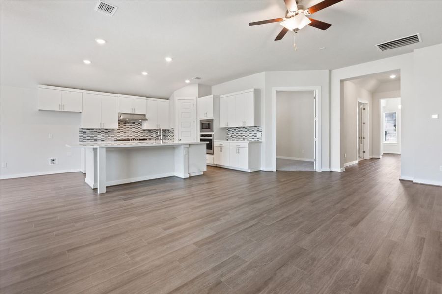 Unfurnished living room featuring recessed lighting, light wood finished floors, and a ceiling fan