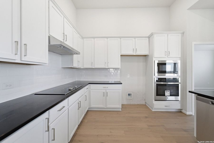 Furnished interior view inside a new home in The Woodlands at Medina Hills, Mico (Image 11).