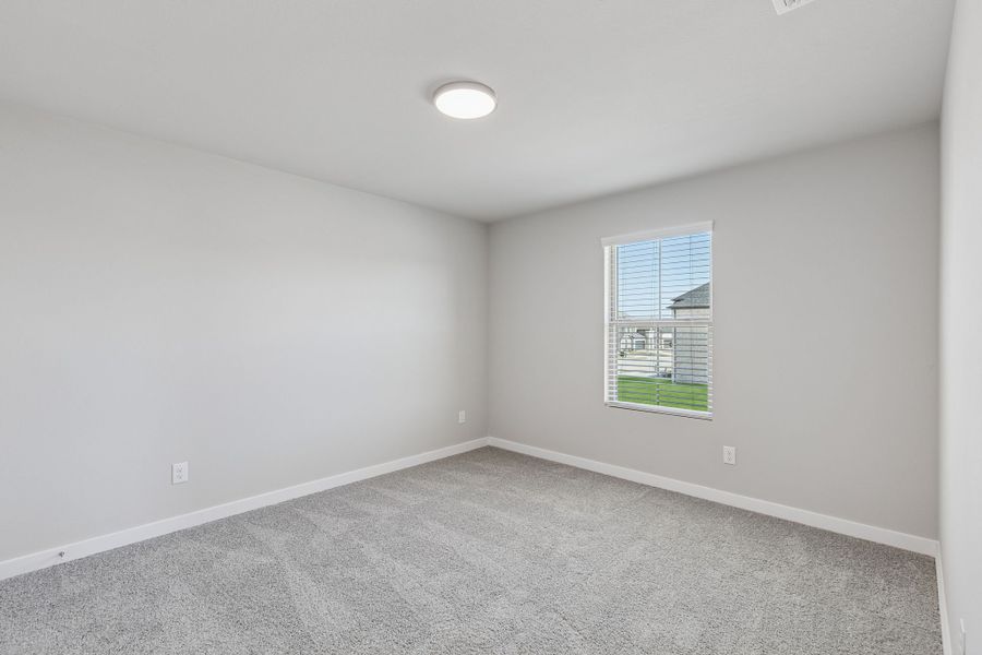 Bedroom in the Holden home plan by Trophy Signature Homes – REPRESENTATIVE PHOTO Bedroom in the Holden home plan by Trophy Signature Homes – REPRESENTATIVE PHOTO