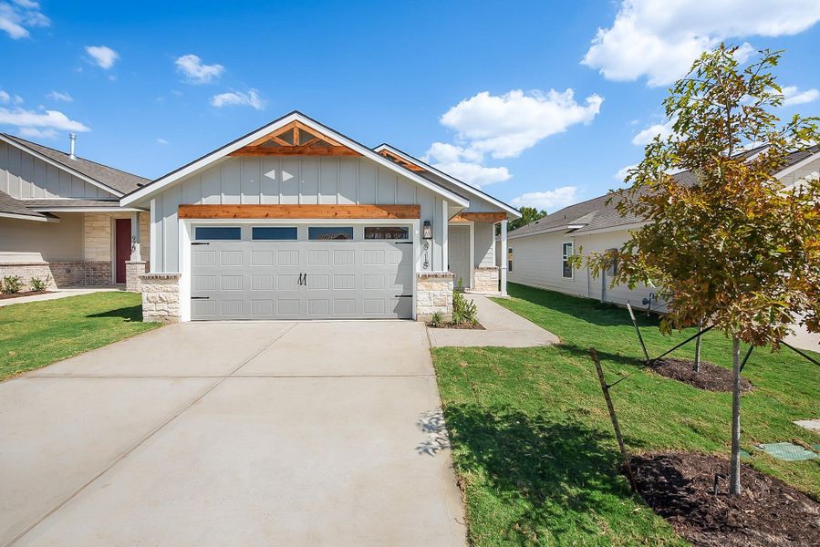 Front exterior of a new home in , College Station, TX, highlighting curb appeal (Image 20).