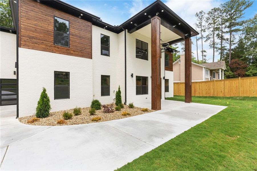 Front exterior of a new home in , Lilburn, GA, highlighting curb appeal (Image 25).