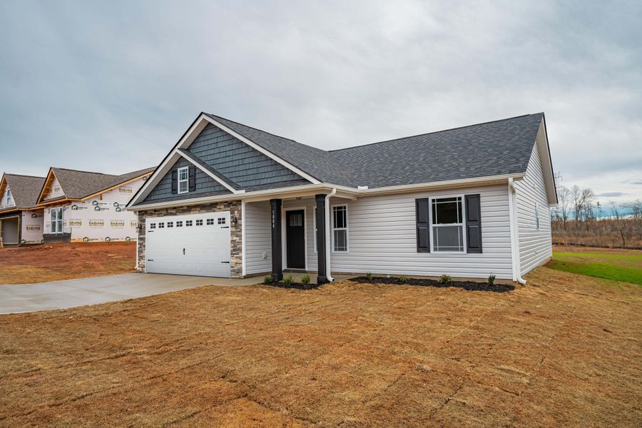 Representative exterior photo of a completed home built from the Saxon by Enchanted Homes in Huckleberry Cove, Chesnee, SC (Image 23). Representative exterior photo of a completed home built from the Saxon by Enchanted Homes in Huckleberry Cove, Chesnee, SC (Image 23).