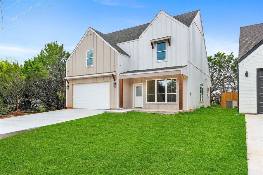 Front exterior of a new home in Canyon Creek, Granbury, TX, highlighting curb appeal (Image 20). Front exterior of a new home in Canyon Creek, Granbury, TX, highlighting curb appeal (Image 20).