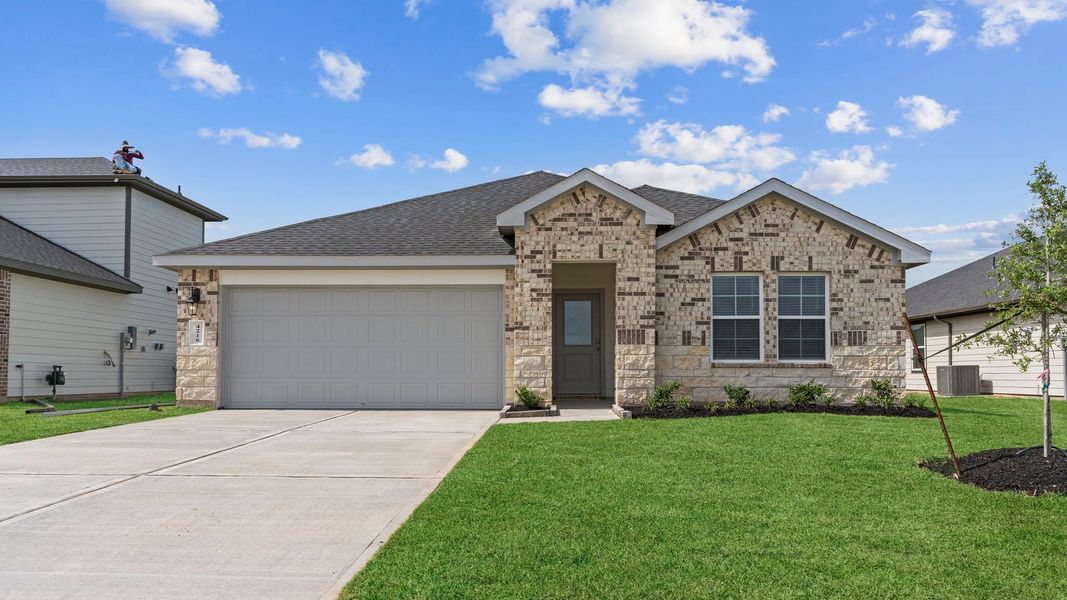 Front exterior of a new home in Blue Heron Estates, Beasley, TX, highlighting curb appeal (Image 1). Front exterior of a new home in Blue Heron Estates, Beasley, TX, highlighting curb appeal (Image 1).