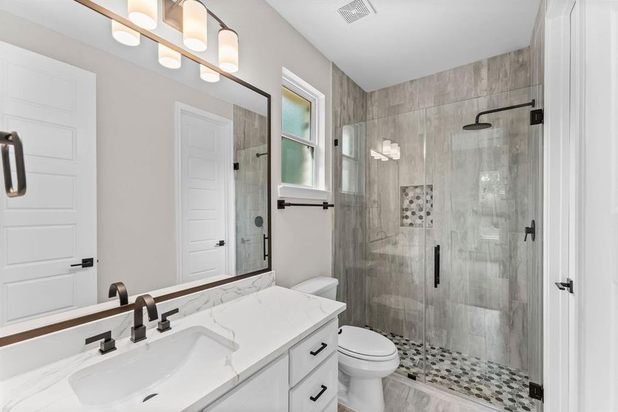 Secondary baths include soft-closing drawers & quartz countertops