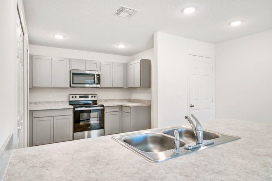 Representative furnished interior of a home built from the Sago by Holiday Builders in Poinciana, Poinciana (Image 5). Representative furnished interior of a home built from the Sago by Holiday Builders in Poinciana, Poinciana (Image 5).