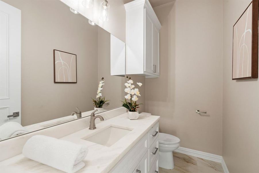 Bathroom featuring toilet and vanity