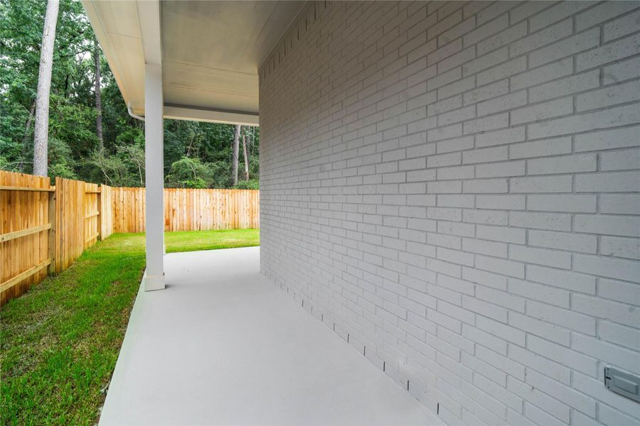 Step outside to the covered rear patio, the perfect extension of your indoor living space for year-round enjoyment. Step outside to the covered rear patio, the perfect extension of your indoor living space for year-round enjoyment.