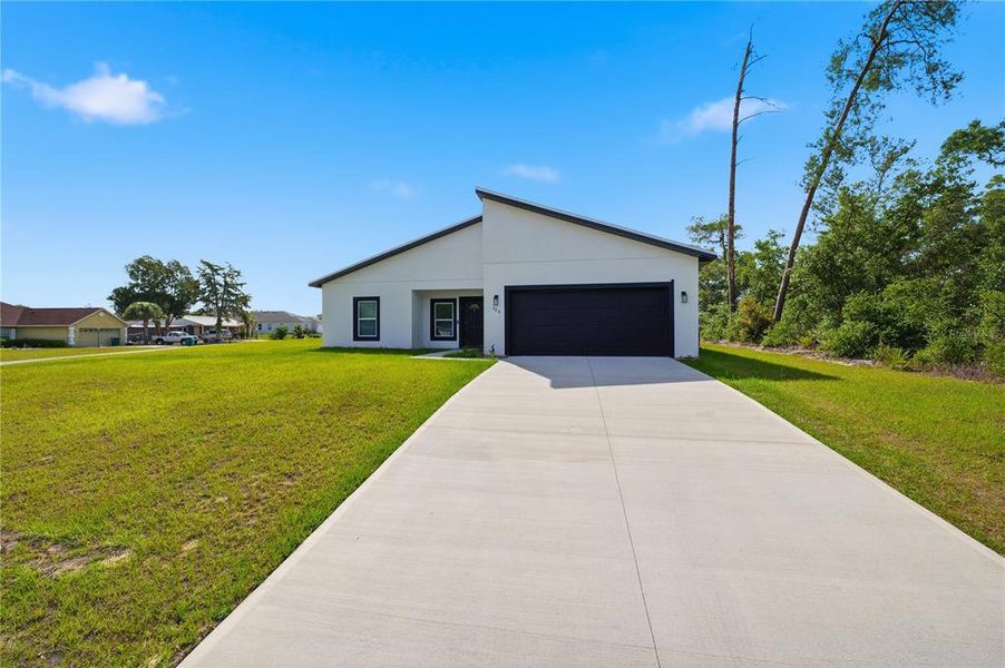 Front exterior of a new home in , Ocala, FL, highlighting curb appeal (Image 21).
