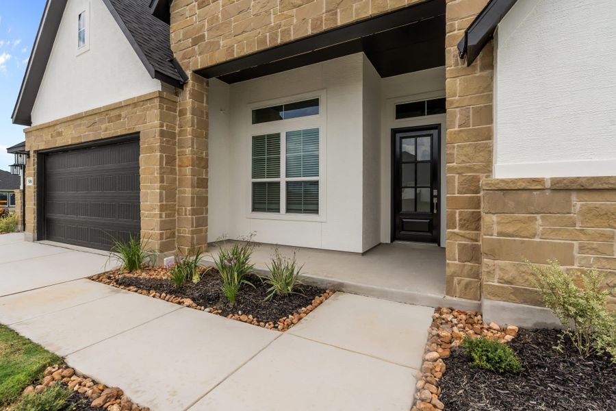 Representative exterior photo of a completed home built from the Brisbane 77′ by Chesmar Homes in Mesa Western, Cibolo, TX (Image 13).