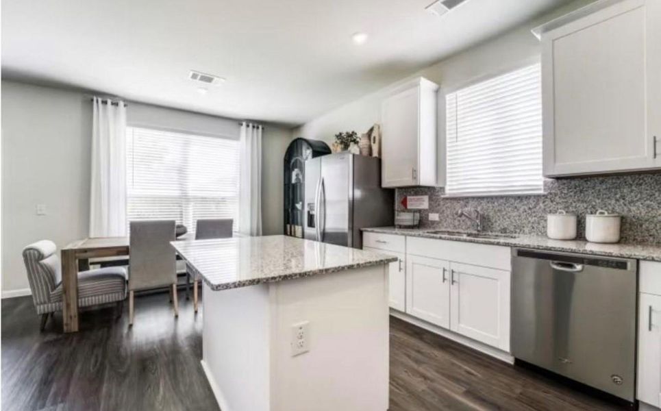 Furnished interior view inside a new home in The Pines At Seven Coves, Conroe (Image 8).