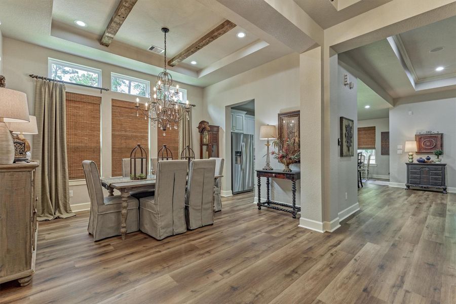 A statement chandelier is the focal point in this formal dining. A statement chandelier is the focal point in this formal dining.