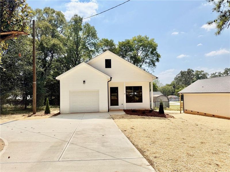 Front exterior of a new home in , Emerson, GA, highlighting curb appeal (Image 18).