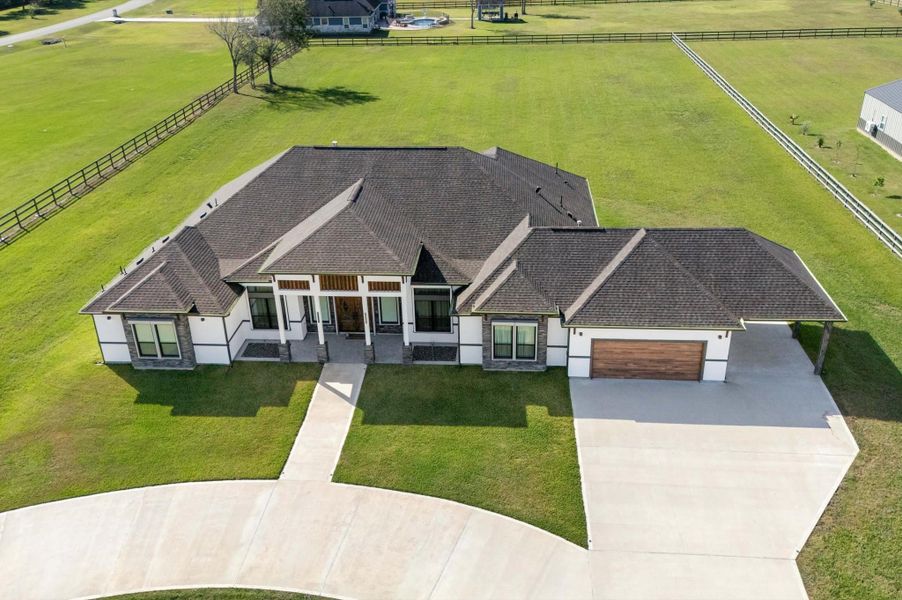 Front exterior of a new home in , Rosharon, TX, highlighting curb appeal (Image 26).