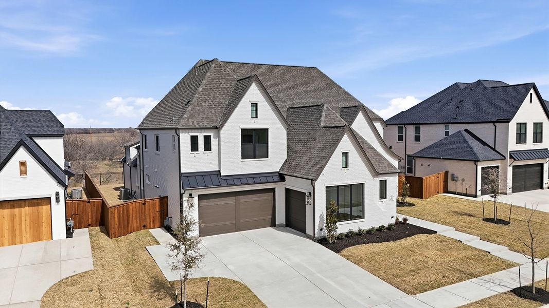 Front exterior of a new home in Light Farms Graham/Reagan, Celina, TX, highlighting curb appeal (Image 28).