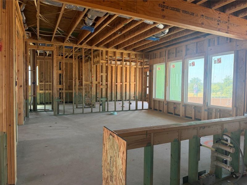 Unfinished framing and concrete floors showcase structural possibilities and open spatial potential.