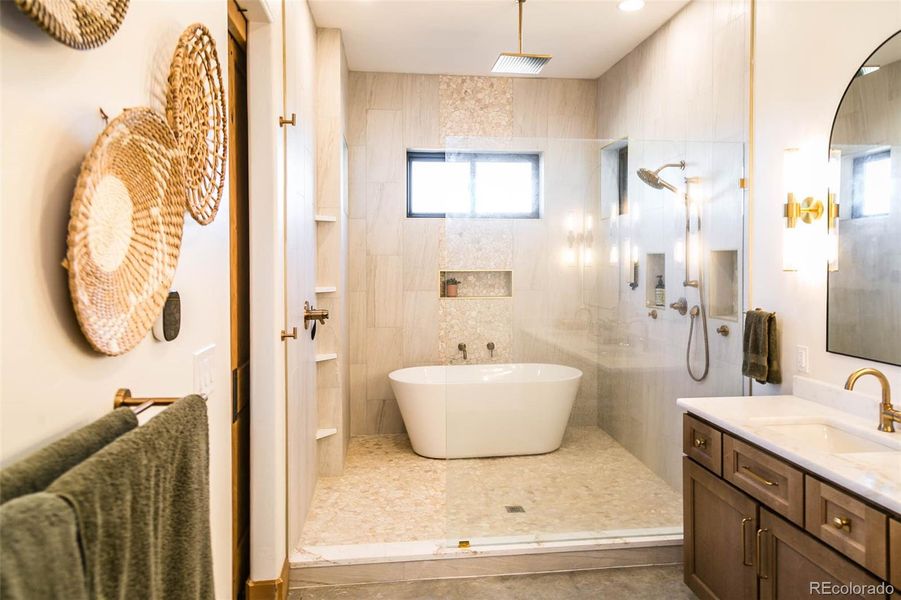 Primary bathroom; 5 piece bath with Iceberg leathered granite, 2 sinks and a private water closet.