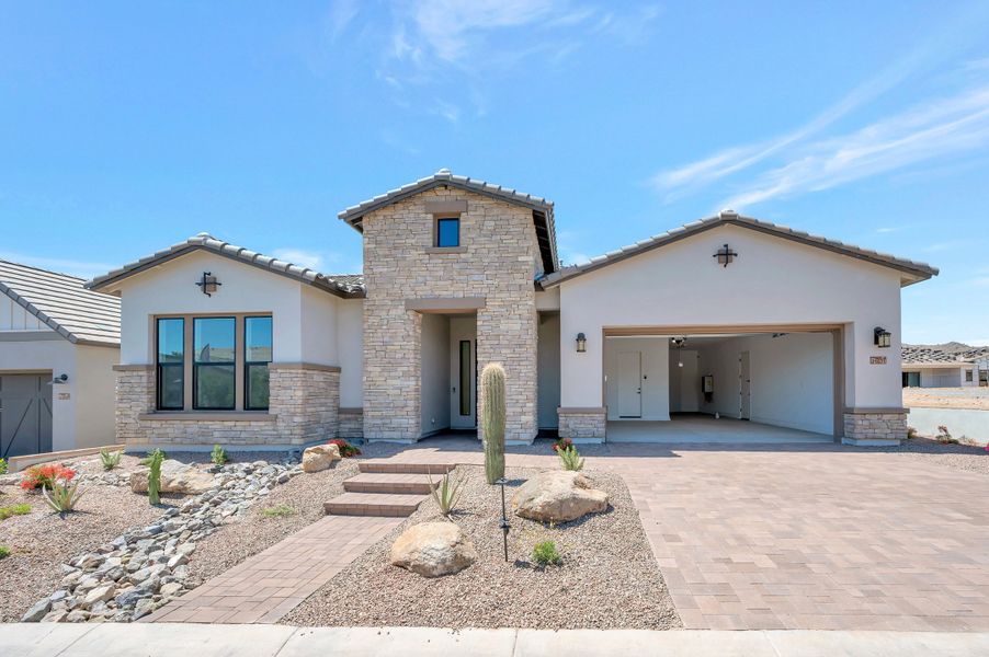 Front exterior of a new home in Overlook at Verrado Regent Hills, Buckeye, AZ, highlighting curb appeal (Image 2). Front exterior of a new home in Overlook at Verrado Regent Hills, Buckeye, AZ, highlighting curb appeal (Image 2).