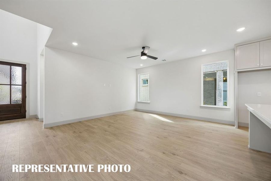 Your spacious new family room is large enough to host the entire family!  REPRESENTATIVE PHOTO