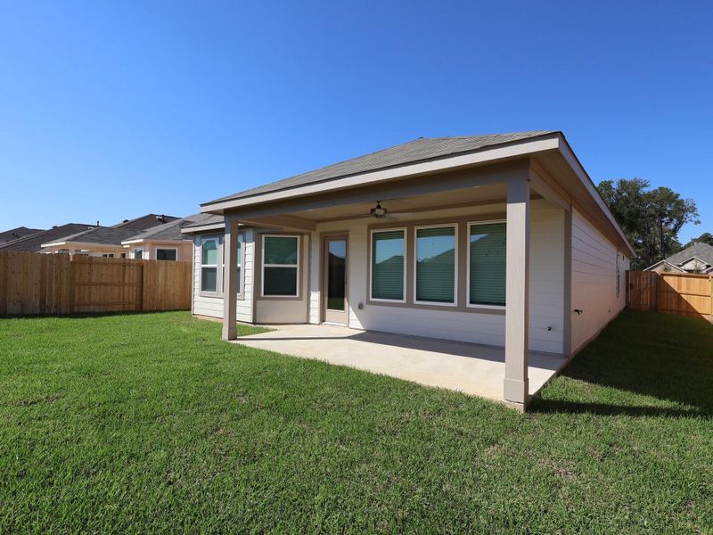 Exterior details and patio area of a home in Pinewood at Grand Texas, New Caney (Image 3). Exterior details and patio area of a home in Pinewood at Grand Texas, New Caney (Image 3).