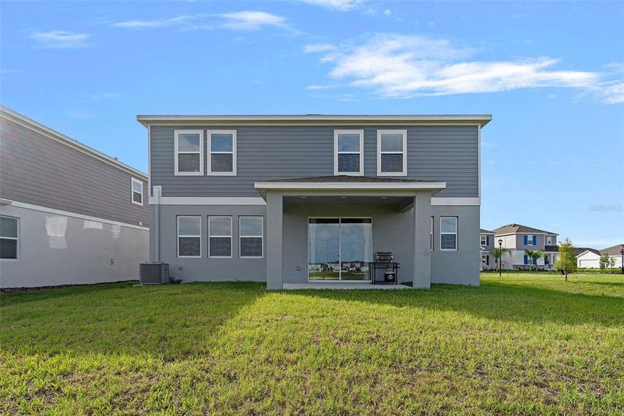 Exterior details and patio area of a home in Wellness Ridge, Clermont (Image 4).
