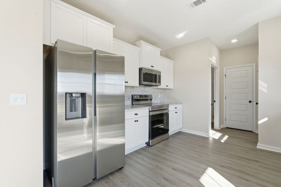 Representative furnished interior of a home built from the The Chatman by RTS Homes in The Gardens at 15 West, Hinesville (Image 9).
