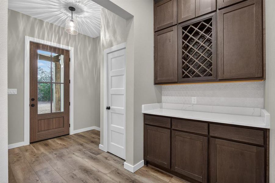 Entryway opens into open spacious living area with a dry bar off to the side!