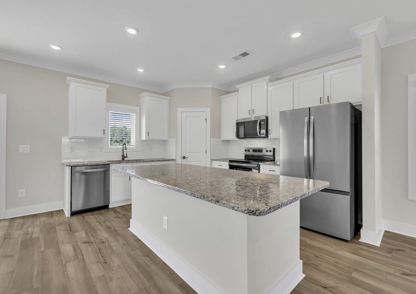 The kitchen has a spacious kitchen island.