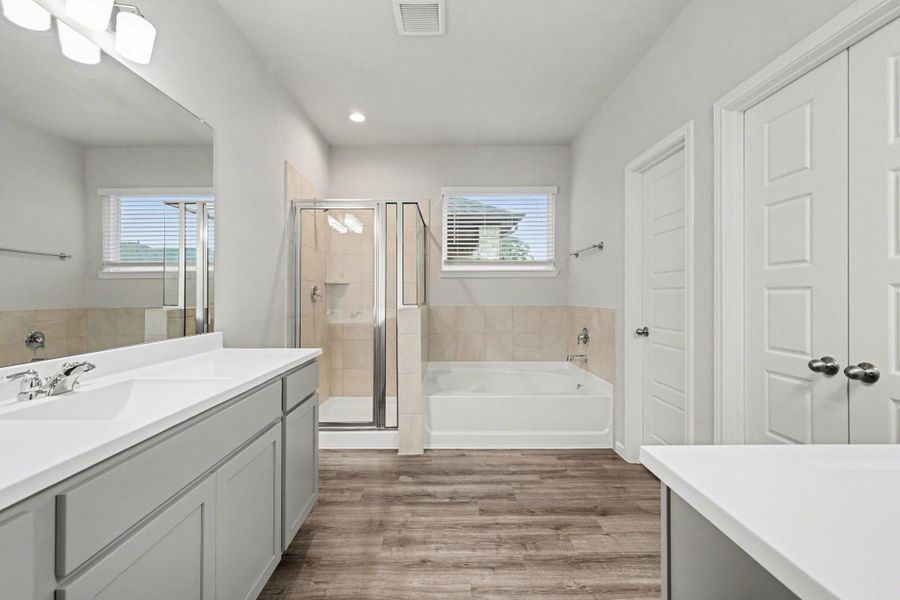 Separate soaking tub and glass-enclosed shower. Separate soaking tub and glass-enclosed shower.